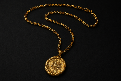 The BG Medallion in solid 24k gold, front view