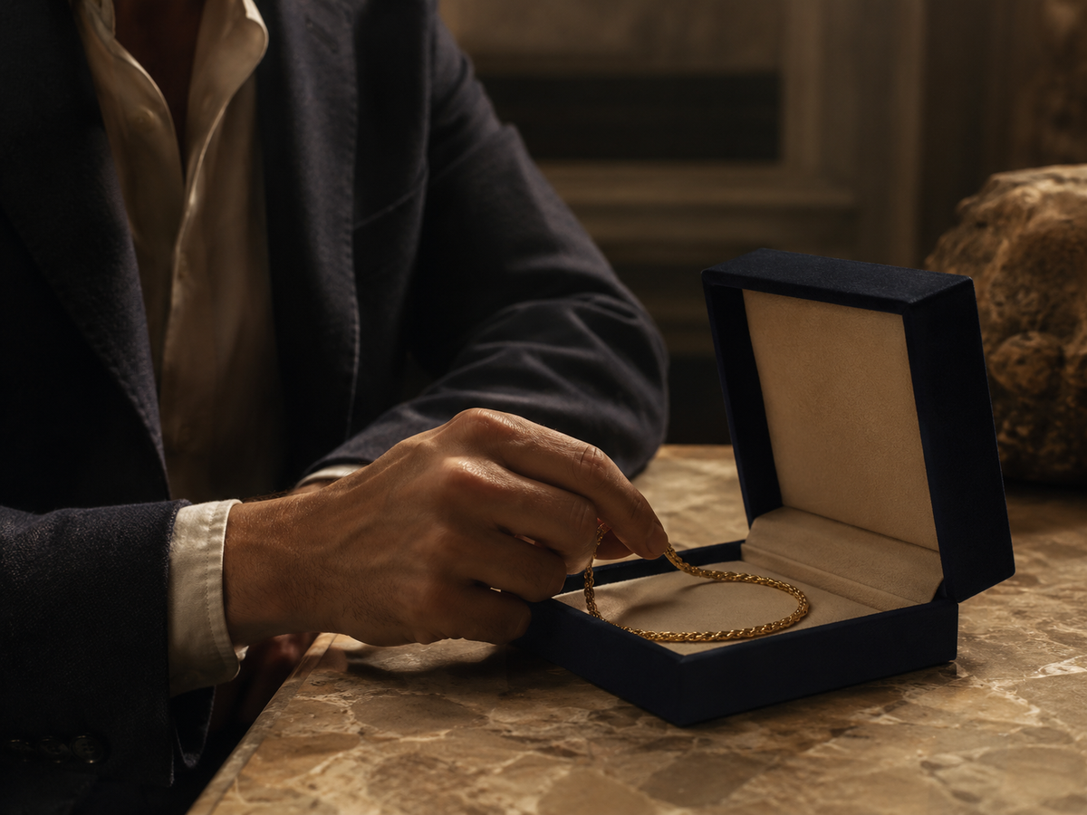 The BG Bracelet in 24k gold, placed in its case